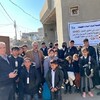 منظمة حمورابي لحقوق الانسان توزيع كسوة شتائية على تلاميذ من مخيم خانك في دهوك.