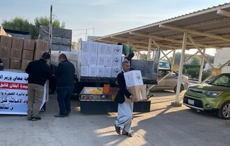 الهجرة توزع 1500 حصة إغاثية للنازحين