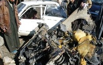 قتلى وجرحي في سلسلة انفجارات ببغداد وتحطم طائرة استطلاع أميركية